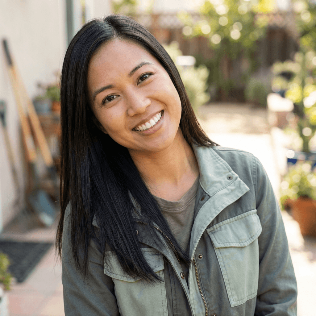 Homeowner smiling in front of her home